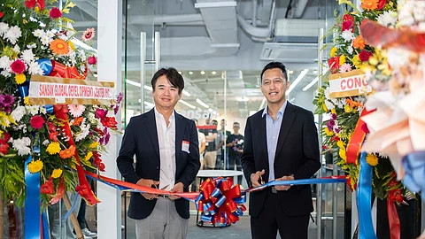 CEBU OFFICE. Kenji Shiomi (left), director and president, Sansan Global Development Center Inc., and director and co-founder of listed Japanese tech firm Sansan Inc.; and Jay Pegarido, director and country manager at Sansan Global Development Center Inc., cut the ribbon to signal the opening of Sansan Global Development Center Inc.'s office at the 1Nito Tower along Archbishop Reyes Avenue, Cebu City on Thursday, Dec. 7, 2023.