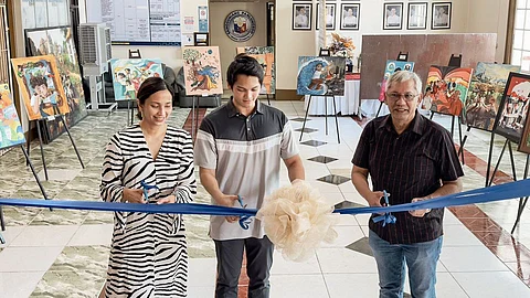 ART EXHIBIT. (from left) Victorias City Mayor Javier Miguel Benitez is flanked by VMC Foundation Executive Director Anne Tiongco and Victorias Milling Company President Linley Retirado during the art exhibit opening at the city hall, Dec. 17
