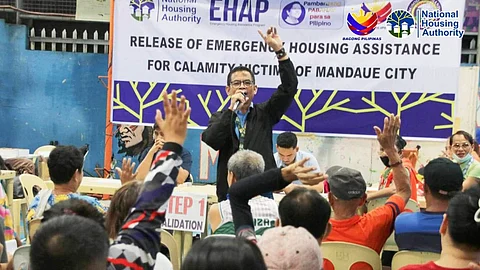 EHAP RECIPIENTS. Victims of super typhoon Odette from 17 barangays in Mandaue City received P10,000 each from the National Housing Authority’s Emergency Housing Assistance Program in December 2023. / NHA