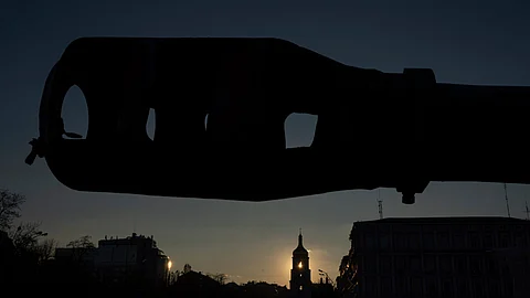 A bell tower of the Saint Sophia Cathedral is seen through the destroyed Russian artillery cannon in downtown Kyiv, Ukraine, on Monday, Jan. 29, 2024.
