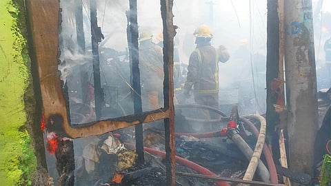 CEBU. Firefighters try to put out the fire that hit Sitio School Zone, Cabajar St., Barangay Guadalupe, Cebu City early morning Sunday, January 28, 2024.