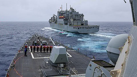 CHINA. In this photo released by the US Navy, The Arleigh Burke-class guided-missile destroyer USS John Finn (DDG 113) prepares to come alongside Lewis and Clark-class dry cargo ship Cesar Chavez (T-AKE-14) in the East China Sea on January 21, 2024.