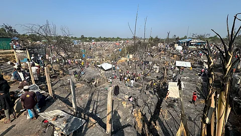 ROHINGYA refugees look on after a midnight fire raced through their refugee camp at Kutupalong in Cox’s Bazar district, Bangladesh, Sunday, Jan. 7, 2024. / AP