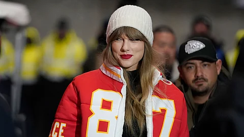 Taylor Swift wears a Kansas City Chiefs tight end Travis Kelce jacket as she arrives before an NFL wild-card playoff football game between the Chiefs and the Miami Dolphins, Saturday, January 13, 2024, in Kansas City, Mo.