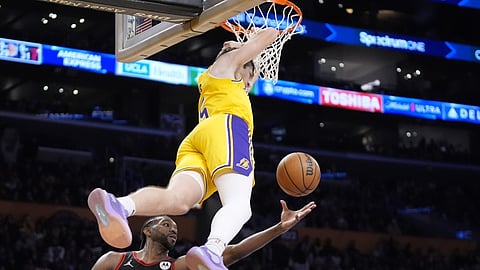 HANSAK: Mikumpayot sa ring si Angeles Lakers guard Austin Reaves human sa iyang paghansak batok sa Chicago Bulls sa usa sa mga aksyon sa NBA ning Biyernes, Enero 26, 2024 (PH time) sa NBA. / AP PHOTO