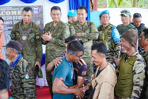 ZAMBOANGA. Two Basilan-based leaders, namely Tanad Nasalon, commander of the 1st Battalion under the 114rg Base command, and his deputy commander, Geon Arasad, of the Moro Islamic Liberation Front (MILF), resolve their long-standing feud through peaceful settlement and signing of a peace covenant in the presence of government officials on Tuesday, January 16. A photo handout shows military officials who are elated as they see former protagonists happily shaking hands and embracing each other during the peace settlement.