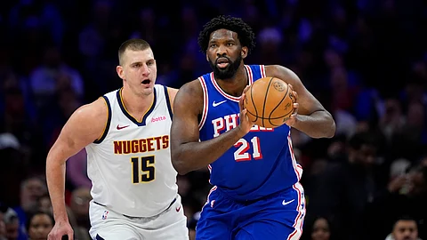 BATTLE. Philadelphia 76ers’ Joel Embiid (right) tries to keep away from Denver Nuggets’ Nikola Jokic during the first half of an NBA basketball game, Tuesday, Jan. 16, 2024, in Philadelphia.