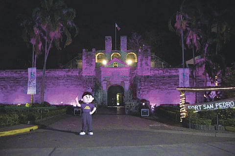Fort San Pedro lit up in purple in a celebratory event on Feb. 22, 2024.