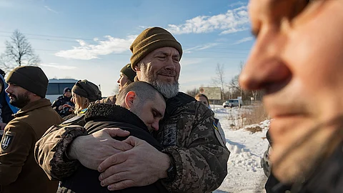 RUSSIA. Recently swapped Ukrainian prisoners of war hug after a prisoner exchange on the Ukrainian Russian border, on Wednesday, January 31, 2024.