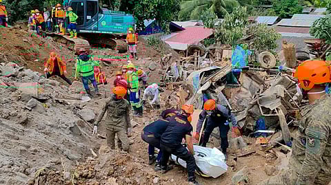 In this picture on February 9, 2024, rescuers recovered bodies covered by a landslide in Barangay Masara in Maco, Davao de Oro.