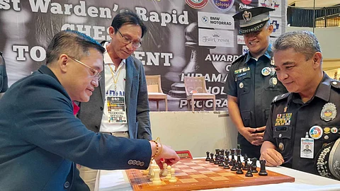 CEREMONIAL MOVE. Senator Christopher “Bong” Go and JSupt Ericley Louise D. Lazaro lead the ceremonial move to usher in the opening of the two-day 1st Warden Rapid Chess Tournament on Saturday, February 3, at the Abreeza Mall Activity Center.