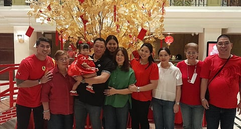 ESCANDOR FAMILY. Glenn Escandor, the president and CEO of the Escandor Group of Companies, carries his first grandchild Kashie, as his family graces The Royal Mandaya Hotel’s Chinese New Year celebration on Saturday night, February 10, 2024.