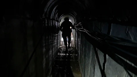 HAMAS TUNNEL. Lt. Col. Ido, whose last name was redacted by the military, walks inside a tunnel underneath the compound of the United Nations Relief and Works Agency for Palestine Refugees in the Near East in Gaza City, where the military discovered tunnels in the main headquarters of the UN agency that the military says Hamas militants used to attack its forces during a ground operation in Gaza, Thursday, Feb. 8, 2024.