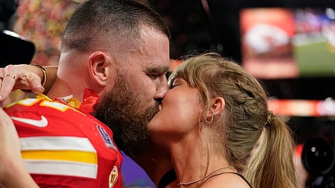 Taylor Swift kisses Kansas City Chiefs tight end Travis Kelce after the NFL Super Bowl 58 football game against the San Francisco 49ers, Sunday, February 11, 2024, in Las Vegas. The Chiefs won 25-22 against the 49ers.