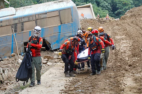 Rescuers carry a body from the landslide-hit village of Masara in Maco, Davao de Oro province, southern Philippines on Thursday Feb. 8, 2024. As of 12 noon of February 11, 2024, 37 deaths have been recorded, while 32 were injured. The rescuers are still looking for 63 missing persons based on the concerned government agencies’ data.