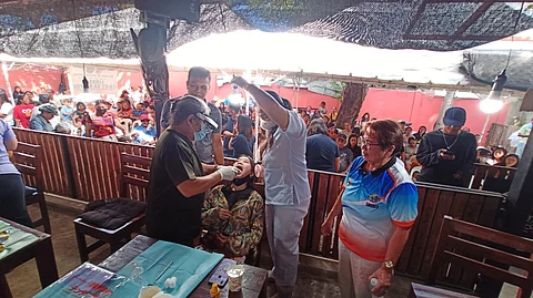 A DENTIST extracts a tooth from a woman in Barangay Marigondon, Lapu-Lapu City on Saturday, Feb. 17, 2024. The activity was part of the dental mission organized by the Outsider MC Mactan Chapter, a group of bikers from Austria.
