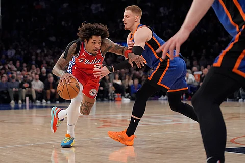Philadelphia 76ers guard Kelly Oubre Jr. (9) drives to the basket against New York Knicks guard Donte DiVincenzo, right, during the first half of an NBA basketball game in New York, Sunday, March 10, 2024.
