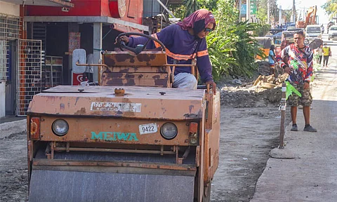 A heavy machinery operator carefully maneuvers the steam roller along the ongoing road construction along Palm Drive in Bajada, Davao City on Thursday, March 7, 2024.