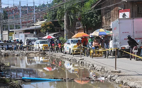 In this file photo taken on July 20, 23, residents in Brgy 74-A in Matina Pangi Road, Davao City complain about the slow ongoing road construction in the area that causes great inconvenience not just to motorists and pedestrians, but also to the dwellers nearby.