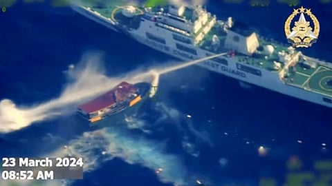 MANILA. In this screengrab from video provided by the Armed Forces of the Philippines, a Chinese coast guard ship uses water cannons on a Philippine resupply vessel Unaizah May 4 as it approaches Second Thomas Shoal, locally called Ayungin shoal, at the disputed South China Sea on Saturday, March 23, 2024.