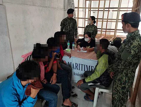 ZAMBOANGA. Authorities rescue 13 potential victims of trafficking in persons in Bongao, the capital town of Tawi-Tawi on Friday, April 19. A photo handout shows the rescued potential victims that were taken to the assistance desk of the Maritime Police and later turned over to the Ministry of Social Welfare and Development for proper disposition.