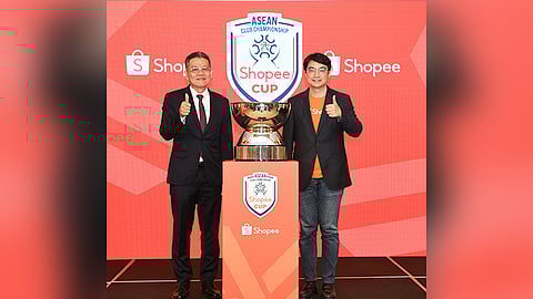 NEW DEAL. Major General Khiev Sameth, President of the ASEAN Football Federation and Zhou Jun Jie, chief commercial officer at Shopee, seal their partnership for the region’s first club championship. /CONTRIBUTED