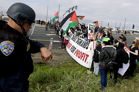 Demonstrators protesting the ongoing war in Gaza, block southbound traffic on Interstate 880 in Oakland, Calif., on Monday, April 15, 2024. Traffic in the San Francisco Bay Area was also snarled for hours Monday morning as pro-Palestinian demonstrators shut down both directions of the Golden Gate Bridge and stalled a 17-mile (27-kilometer) stretch of Interstate 880 in Oakland.