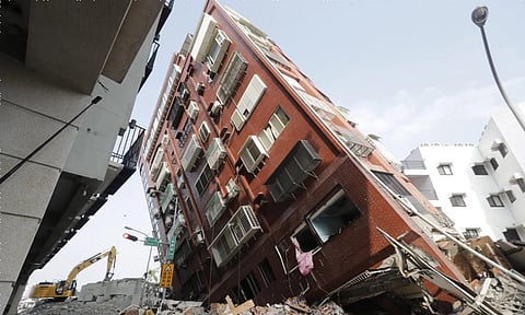 Rescuers searched for dozens of people out of contact Thursday a day after Taiwan’s strongest earthquake in a quarter century damaged buildings, caused multiple rockslides and killed nine people.