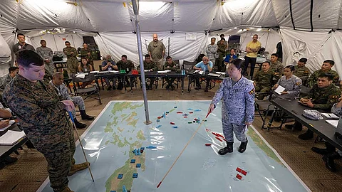 MANILA. Lt. Cmdr. Maria Christina Roxas, chief of External Affairs Branch of the Philippine Navy’s Public Affairs Division, briefs her team’s Information Operation plan to participants during the Information Warfighter Exercise ahead of Exercise Balikatan 24 at Camp Aguinaldo on April 4.