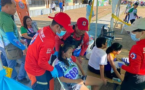 FIRST AID. Volunteers of the Philippine Red Cross (PRC) tend to athletes needing assistance at the first aid station in Panaad Park and Stadium in Bacolod City on Tuesday (April 2, 2024). The Panaad facilities are among the venues of the ongoing Negros Occidental Provincial Meet.
