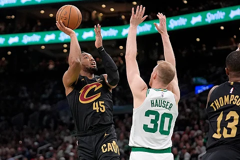 Cleveland Cavaliers guard Donovan Mitchell (45) shoots as Boston Celtics forward Sam Hauser (30) defends during the second half of Game 2 of an NBA basketball second-round playoff series Thursday, May 9, 2024, in Boston.