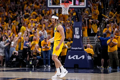 Indiana Pacers guard Andrew Nembhard celebrates after making a three-point basket during the second half of Game 3 against the New York Knicks in an NBA basketball second-round playoff series, Friday, May 10, 2024, in Indianapolis. The Pacers won 111-106.