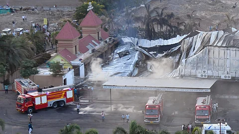 Firefighters douse a fire which broke out in a fun park, in Rajkot in the Indian state of Gujarat, Saturday, May 25, 2024. A massive fire broke out on Saturday in a fun park in western India, killing more than ten people and injuring some others, news reports said.