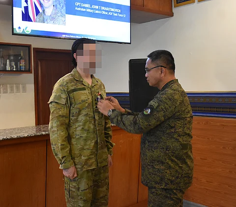 ZAMBOANGA. The Western Mindanao Command (Westmincom) accords honors to Captain Daniel John Dragutinovich of the Australian Defence Force (left) who has served as military liaison officer for six months at Camp Navarro that houses the Westmincom headquarters in Zamboanga City. Colonel Rey Pasco, acting chief of Unified Command Staff of Westmincom (right), pinned a Military Civic Action Medal to Dragutinovich in a simple ceremony on Friday, May 3, at the Bautista Lounge of Westmincom headquarters.