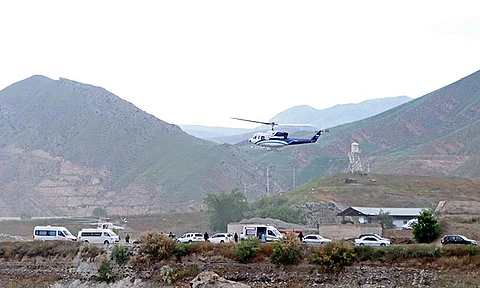 In this photo provided by Islamic Republic News Agency, IRNA, the helicopter carrying Iranian President Ebrahim Raisi takes off at the Iranian border with Azerbaijan after President Raisi and his Azeri counterpart Ilham Aliyev inaugurated dam of Qiz Qalasi, or Castel of Girl in Azeri, Iran, Sunday, May 19, 2024. A helicopter carrying President Raisi suffered a "hard landing" on Sunday, Iranian state media reported, without elaborating.