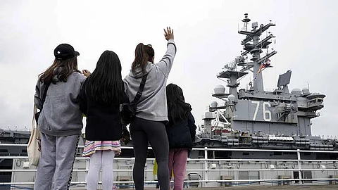 JAPAN. Family members of the crew of the US navy aircraft carriers USS Ronald Reagan (CVN-76) see off at the US navy's Yokosuka base Thursday, May 16, 2024, in Yokosuka, south of Tokyo.