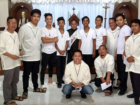 SAN CARLOS CITY. Catholic priest Noel Froilan Maravillas (center), the leader of Society of San Pedro Calungsod, along with his members.