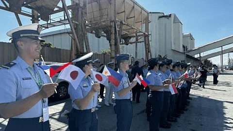 SEND-OFF. Personnel of the Philippine Coast Guard wave the flags of the Philippines, Indonesia, and Japan during the send-off ceremony of the Regional Marine Pollution Exercise (MARPOLEX) 2024 at the Bredco port in Bacolod City on Friday (June 28, 2024). The three countries conducted exercises on firefighting, search and rescue, and oil spill response along the Guimaras Strait on Wednesday (June 26). (Photo courtesy of Philippine Coast Guard)
