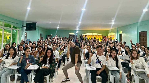 LIGHT MOMENT. In this June 3, 2024 photo, Froilan Jake Obeal (center) strikes a pose with the future generation of educators in a photo opportunity during one of his Licensure Examination for Professional Teachers classes. / CONTRIBUTED PHOTO