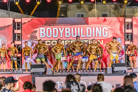 The Kandaya Fitness Festival features top bodybuilders who are showcasing their strength and form to the appreciative audience.