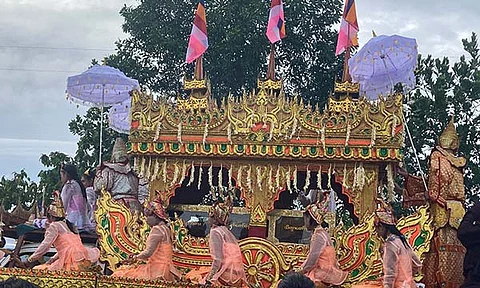 A vehicle with an elaborate design as a traditional Karaweik vessel carries the late monk Bhaddanta Munindarbhivamsa in a funeral cortege to be cremated in Bago, Myanmar, Thursday, June 27, 2024. The senior monk was shot dead last week by soldiers who the military government said mistaked the vehicle in which he was traveling for a security threat.