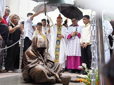 MANILA. Cardinal Jose Advincula leads the blessing of the statue, “When I was hungry and thirsty,” at the Baclaran Church compound on June 27, 2024.