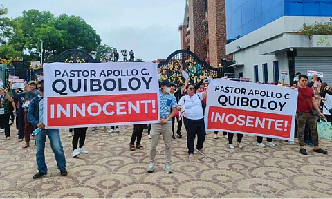 Members and workers of the Kingdom of Jesus Christ (KOJC), headed by Pastor Apollo Quiboloy, gathered outside the KOJC compound in Davao City Monday morning, June 10, 2024, in solidarity with their religious leader, who is facing charges for sexual and human trafficking.