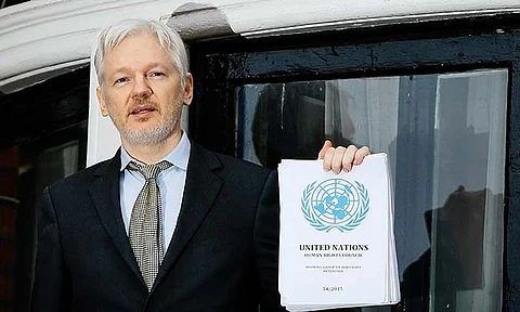WikiLeaks founder Julian Assange speaks on the balcony of the Ecuadorean Embassy in London, Feb. 5, 2016. Assange will plead guilty to a felony charge in a deal with the U.S. Justice Department that will free him from prison and resolve a long-running legal saga over the publication of a trove of classified documents.