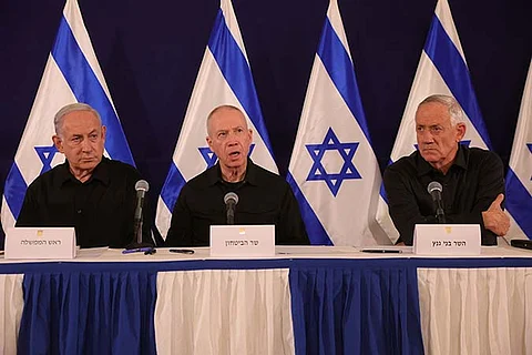 From left, Israeli Prime Minister Benjamin Netanyahu, Defense Minister Yoav Gallant and Cabinet Minister Benny Gantz speak during a news conference in the Kirya military base in Tel Aviv, Israel on Oct. 28, 2023. Israeli officials said Monday, June 17, 2024, that Netanyahu has dissolved the influential War Cabinet that was tasked with steering the war in Gaza.