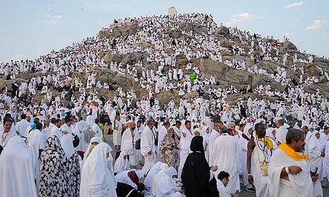Muslim pilgrims gather at the top of the rocky hill known as the Mountain of Mercy, on the Plain of Arafat, during the annual Hajj pilgrimage, near the holy city of Mecca, Saudi Arabia, Saturday, June 15, 2024.