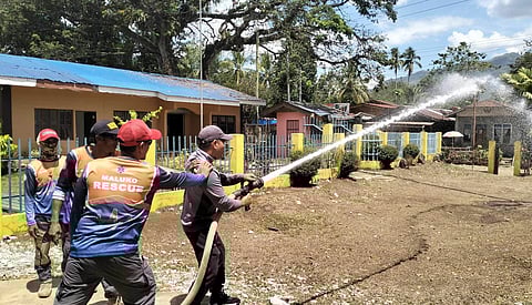 SAFETY HEROES. Community volunteers in Barangay Santiago and Maluko, Manolo Fortich, Bukidnon, gear up for intensive firefighting training, ready to protect their communities.
