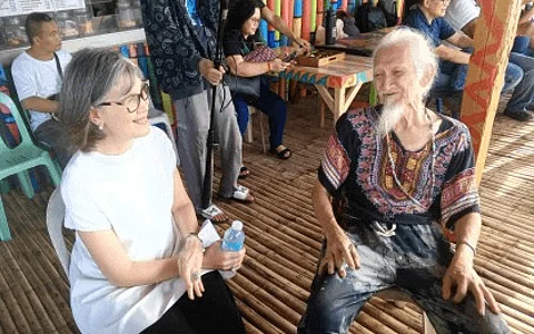 RENOWNED PAINTER. Famed Negrense visual artist Nunelucio Alvarado (right) with Negros Occidental Fifth District Board Member Rita Gatuslao, who was among the local government officials who witnessed the “Haligi” installation to celebrate the works and contributions of Alvarado to arts and culture on June 11, 2024. The City of Sagay, the artist’s hometown, nominated him for the Order of National Artist. (PNA-Bacolod photo)