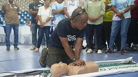 Emergency rescue doctor Ted Esguerra demonstrates CPR for use in critical care transport.
