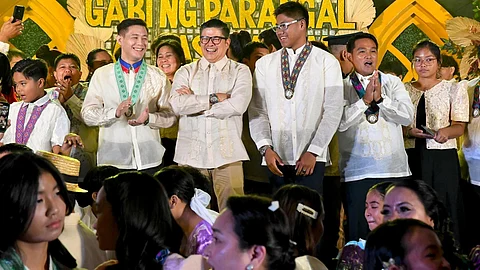 CHAMPIONS' CHEERS. Davao City's Cambodia SEA Games jiu-jitsu gold medalist Marc Alexander Reyes, SDD-CMO officer-in-charge Mikey Aportadera, and Batang Pinoy 2023 swimming MVP Paolo Miguel Labanon share a joyful moment on stage during the Gabi ng Parangal at Pasasalamat, an athletes and coaches' recognition night held at SMX Convention Center on June 30, 2024.